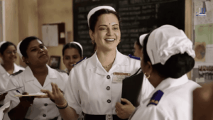 Kangana Ranaut as a smiling nurse with hospital staff in Bharat Bhagya Vidhata movie 2026