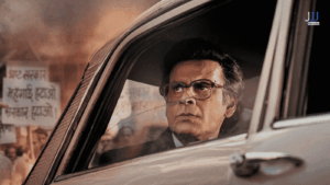 Manoj Bajpayee in Governor 2026 looking tense inside car with protest crowd in background