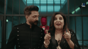 Farah Khan and Riteish Deshmukh as hosts of Lock Upp Season 2 on Netflix - the two jailors stand together in black outfits inside the lock-up set