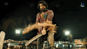 Ram Charan as Peddi swinging a cricket bat with intense energy during a night match scene in the 2026 Telugu film Peddi